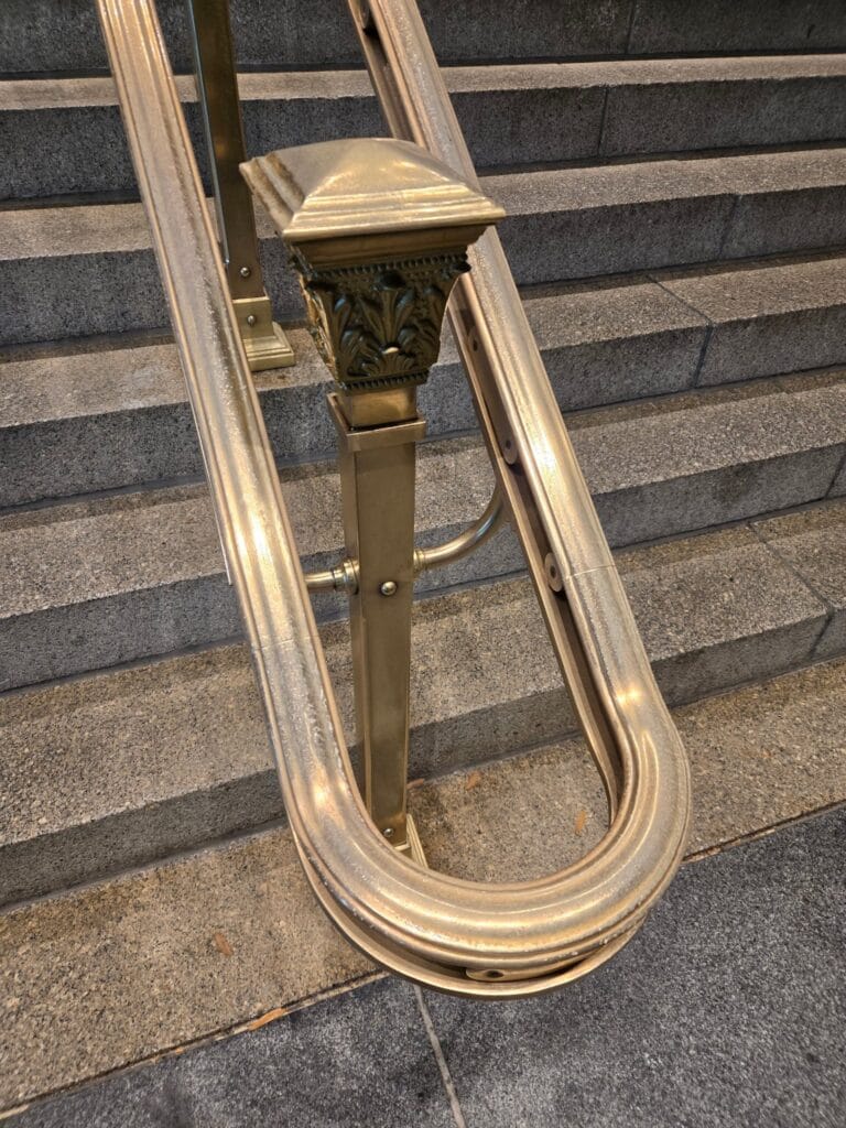 Polished brass stair handrail