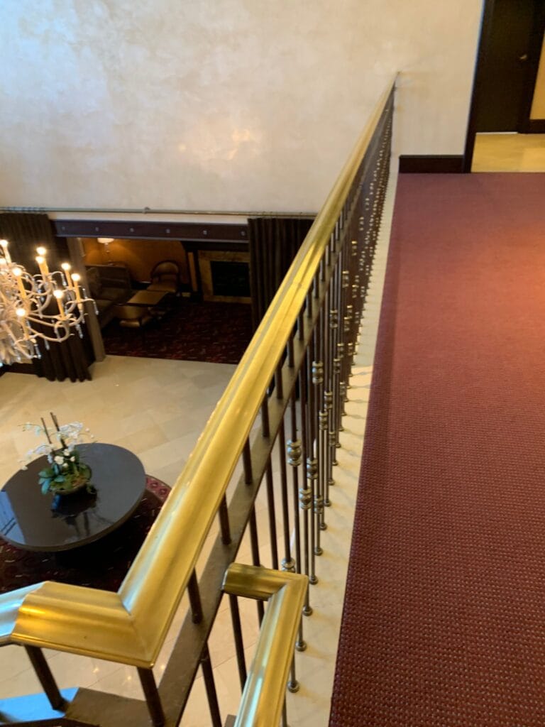 Polished brass stair railing in a hotel