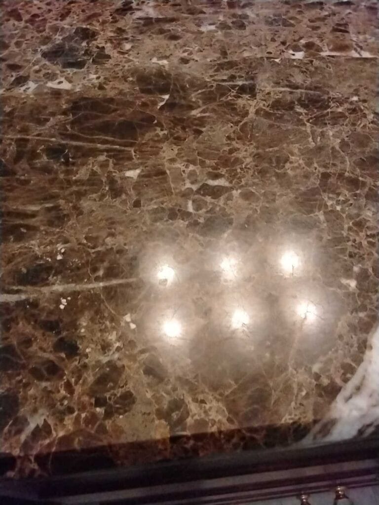 Polished brown marble countertop from a Rose Restoration job in Arlington, VA