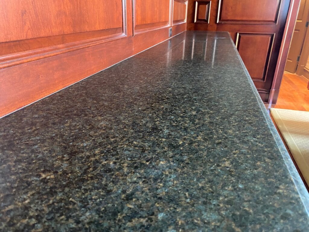 Polished dark granite kitchen countertop