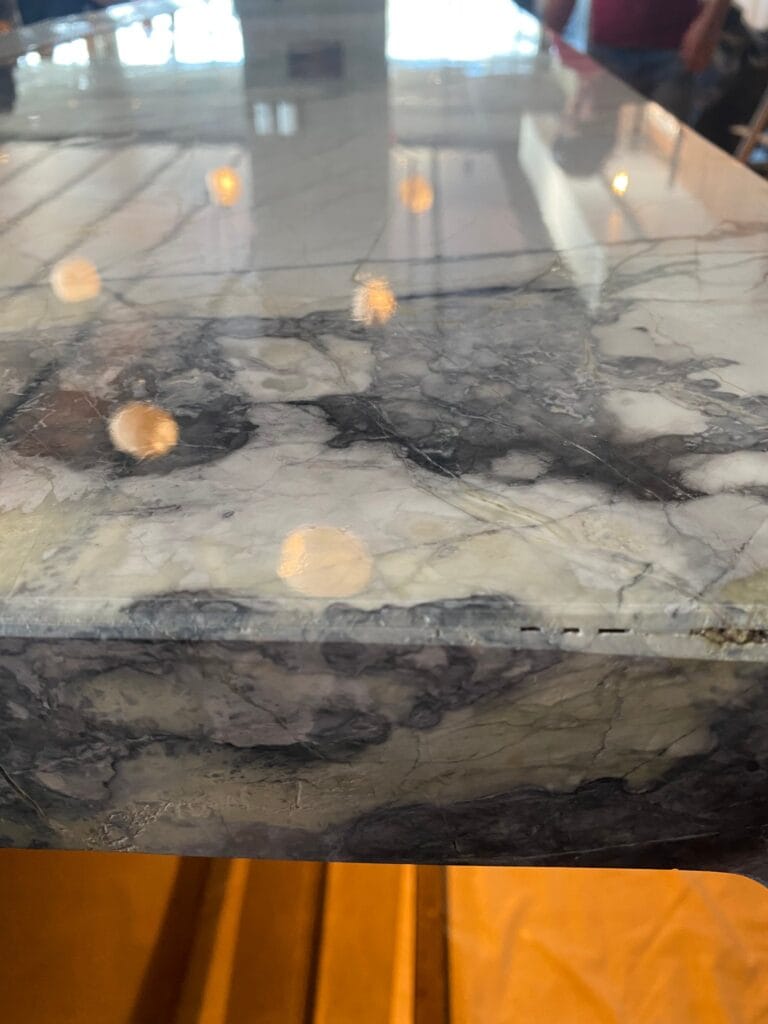 Polished dark veined stone edge