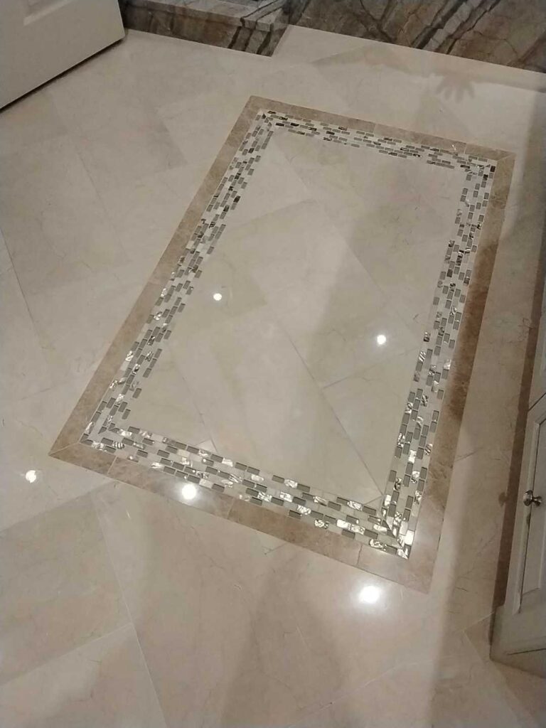 Polished marble floor with mosaic border from a Rose Restoration job in Fairfax, VA