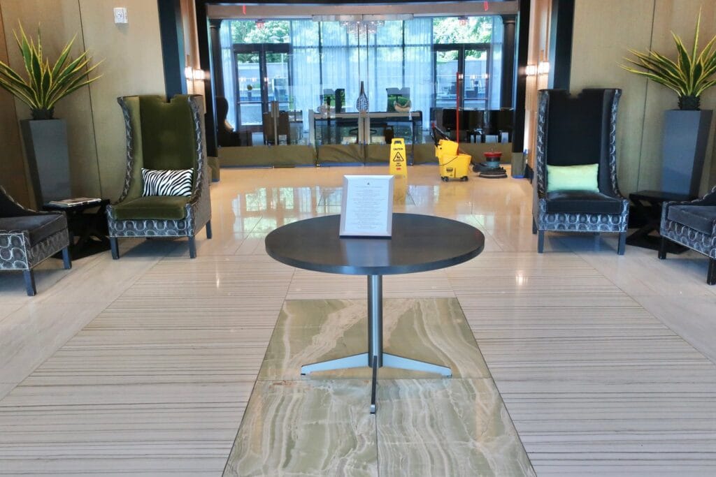 Polished marble lobby floor with a center table