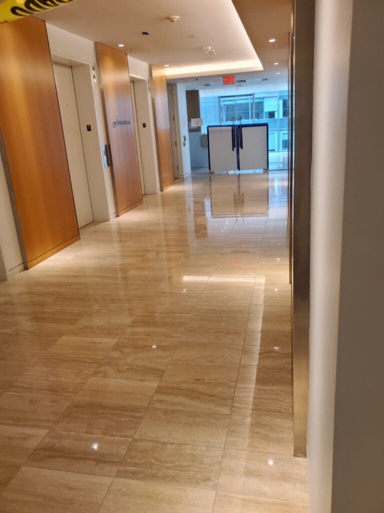 Polished stone floor in an office building elevator corridor