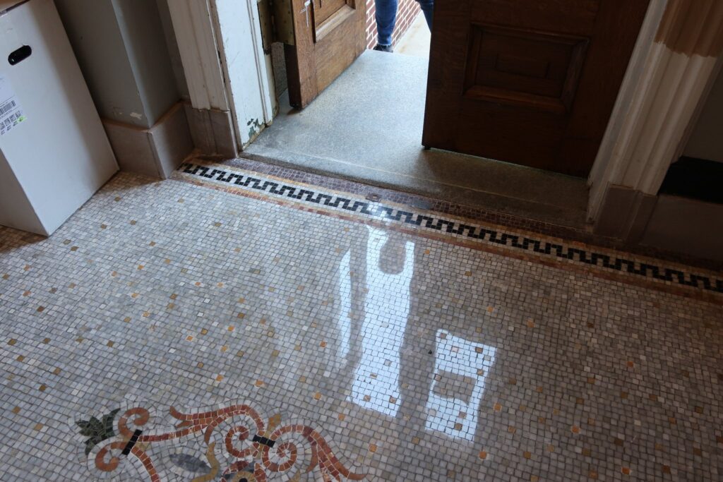 Polished terrazzo floor with an ornamental border