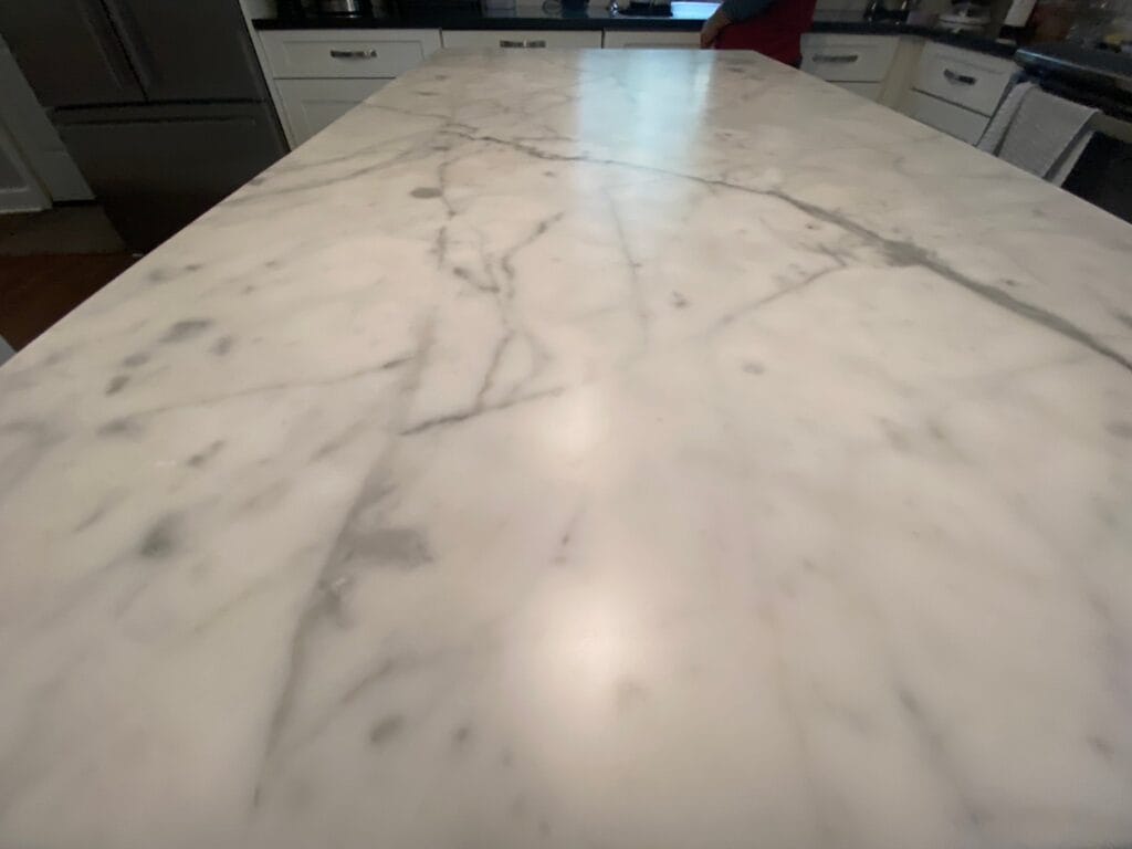 Polished white marble kitchen island