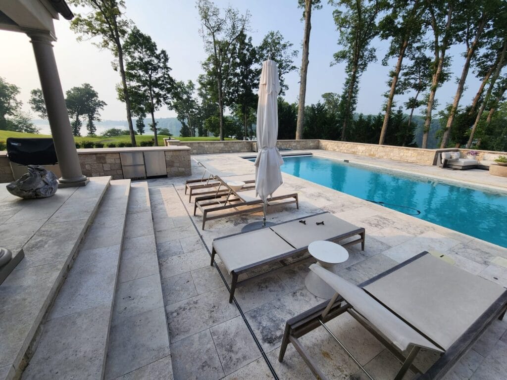 Pool with stone steps and deck