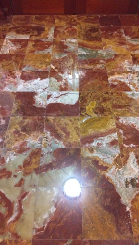 Red and gold veined stone surface from a Rose Restoration job in Annandale, VA