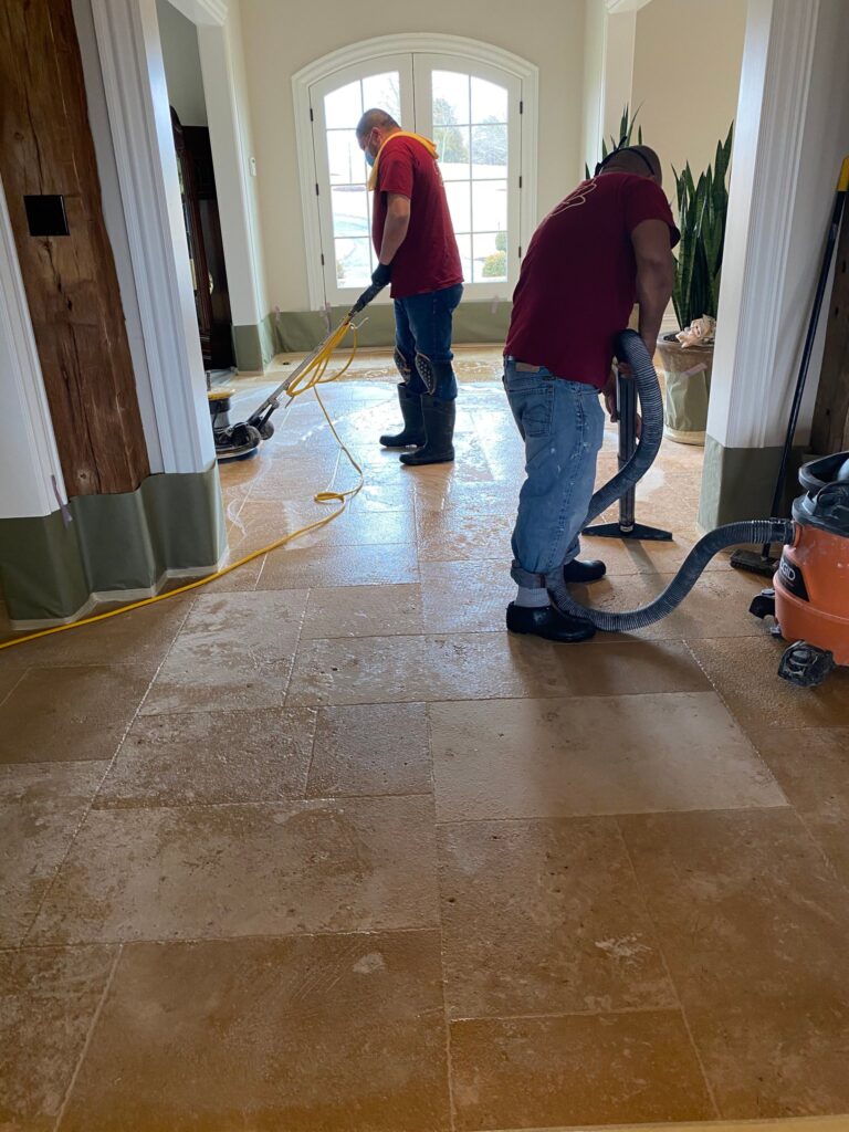 Rose crew working on a stone floor in a bright room