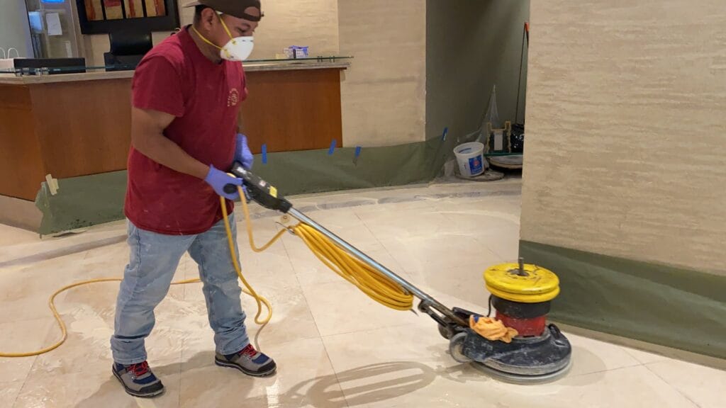 Rose technician honing a marble floor with a floor machine