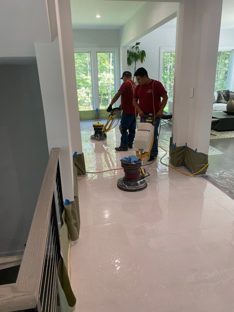 Rose technician polishing a white marble floor