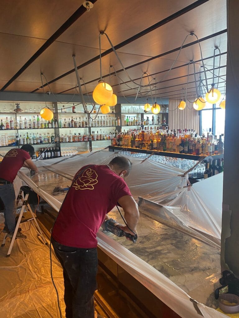 Rose technician working on a protected restaurant bar top