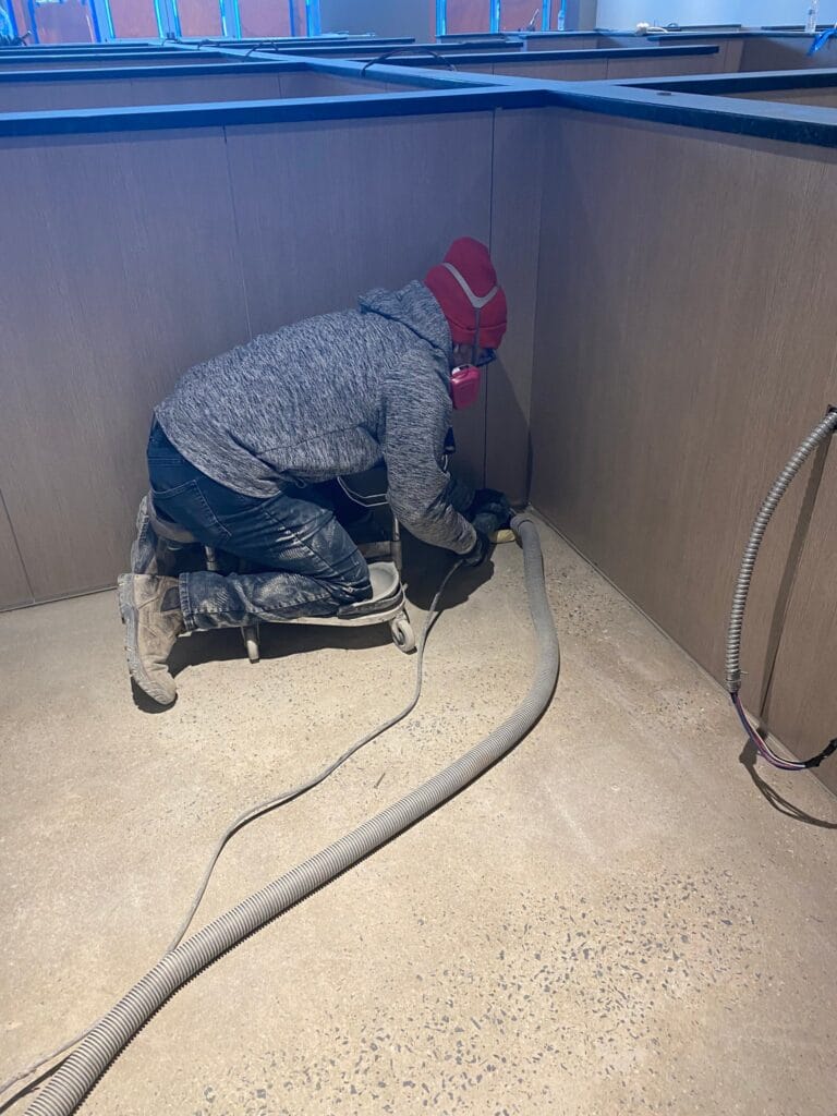 Rose technician working on floor grout