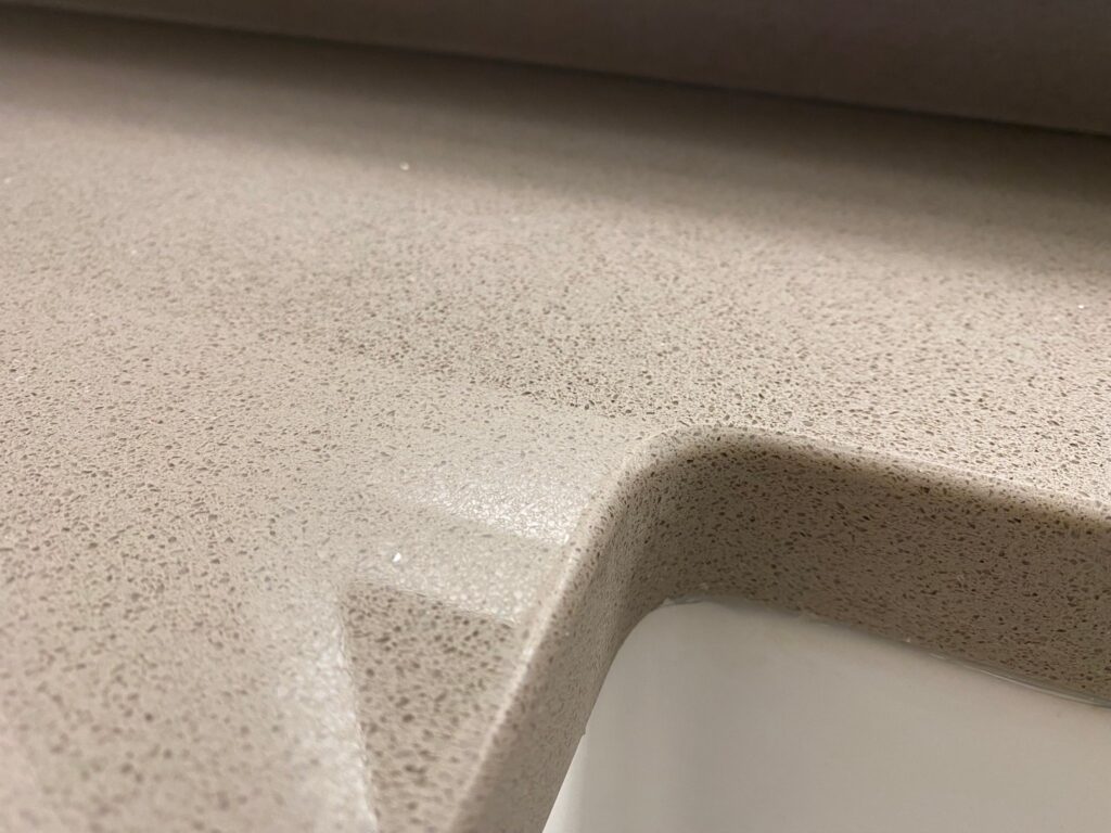 Speckled countertop with an integrated sink