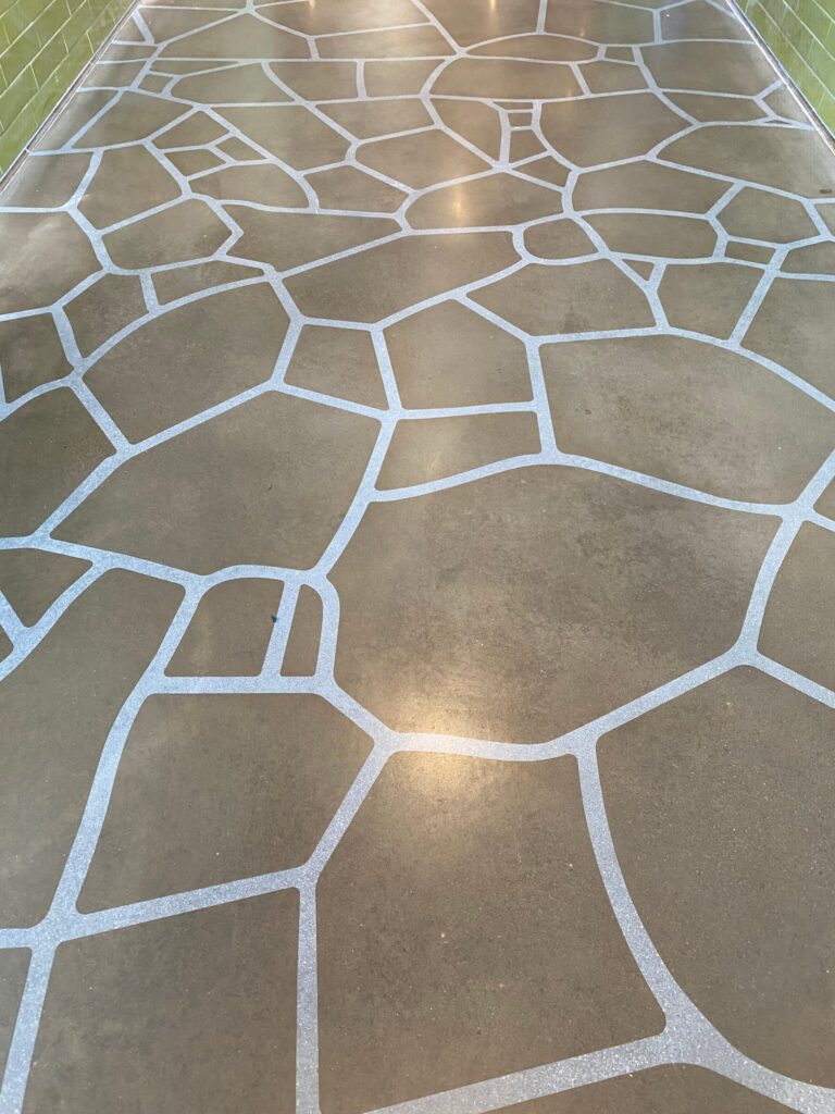 Stenciled concrete floor with a flagstone pattern