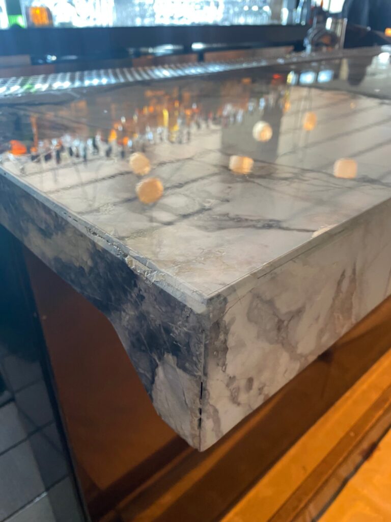Stone bar top edge in a restaurant, protected with Marble Armor