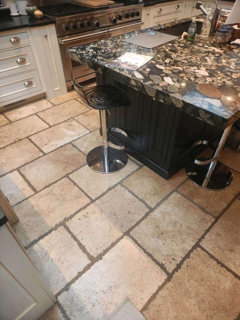 Stone countertop with bar stools from a Rose Restoration job in Chevy Chase, MD