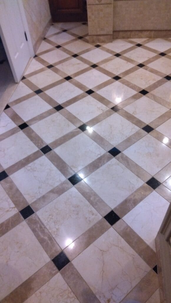 Stone floor with a dark diamond grid from a Rose Restoration job in Manassas, VA