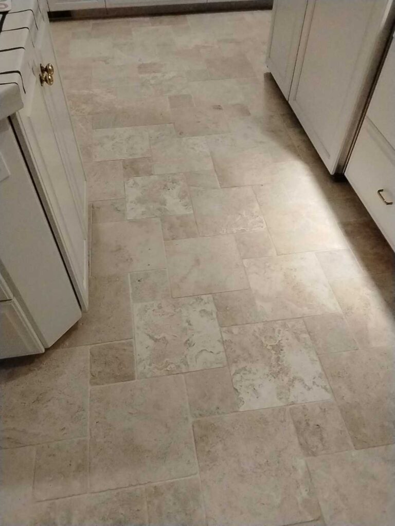 Stone kitchen floor with beige tiles from a Rose Restoration job in Potomac, MD