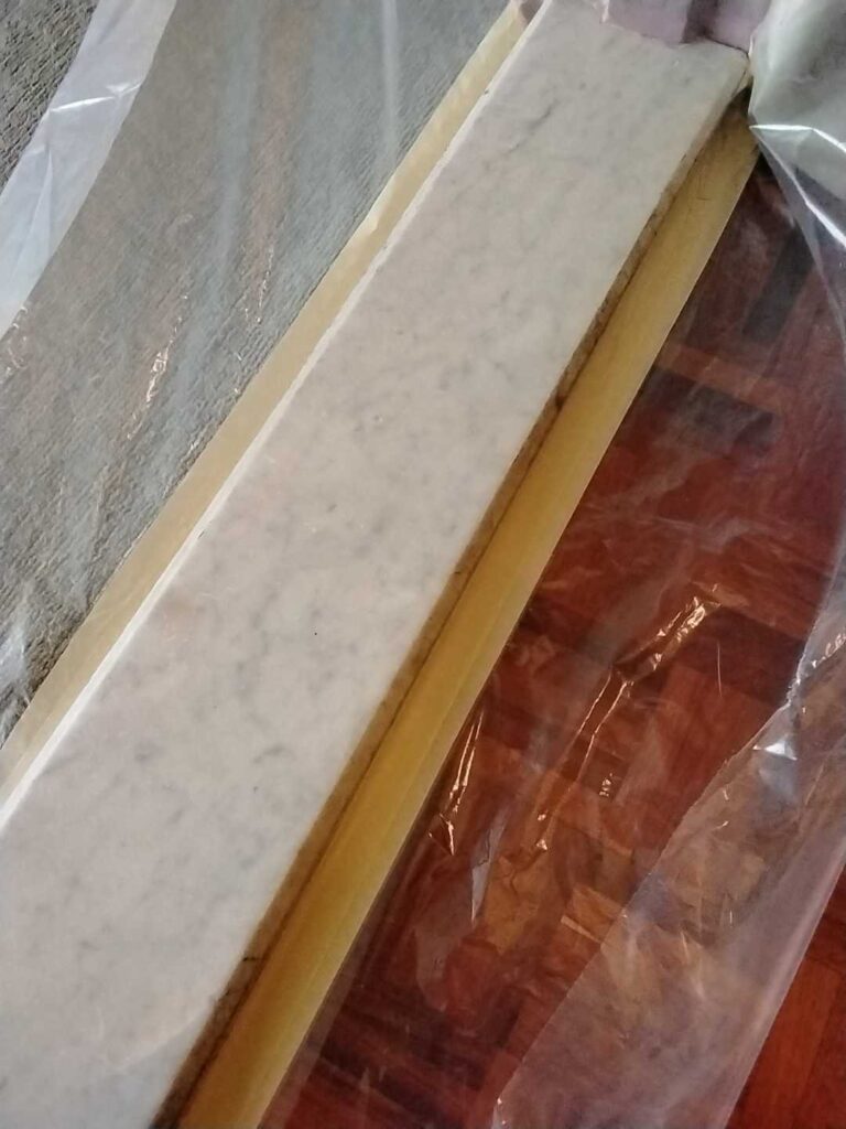 Stone slab with wooden edge from a Rose Restoration job in Arlington, VA