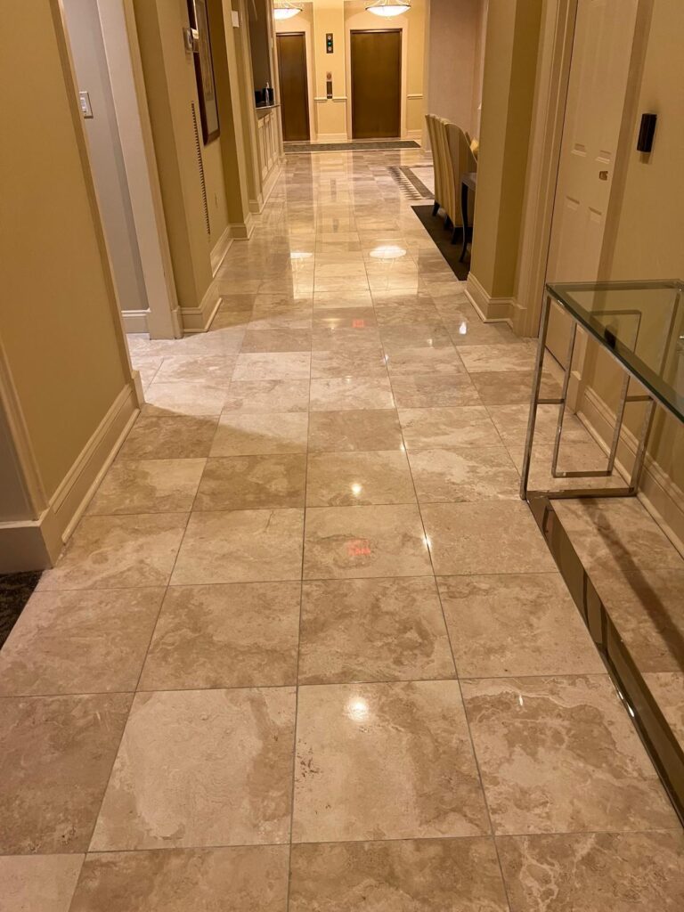 Polished travertine corridor floor in a residential building