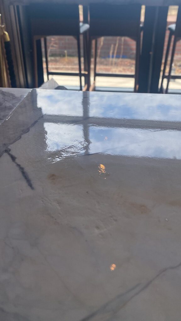 Wet polished stone surface