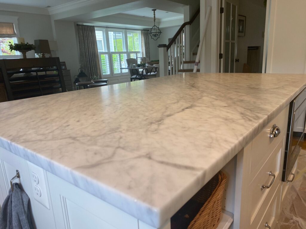 White marble countertop by a window