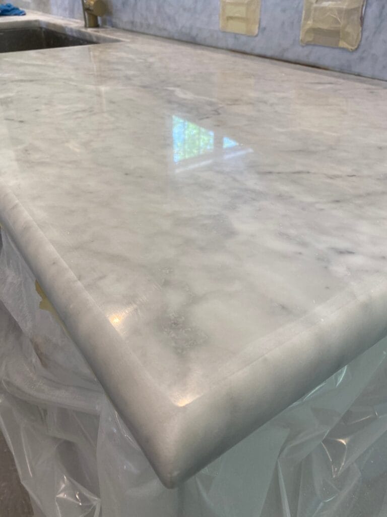 White marble countertop edge after polishing