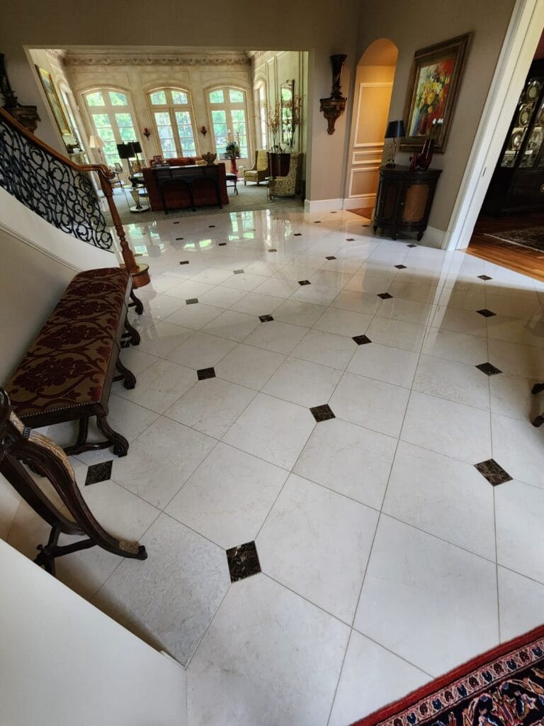 White marble foyer floor with black diamond inserts