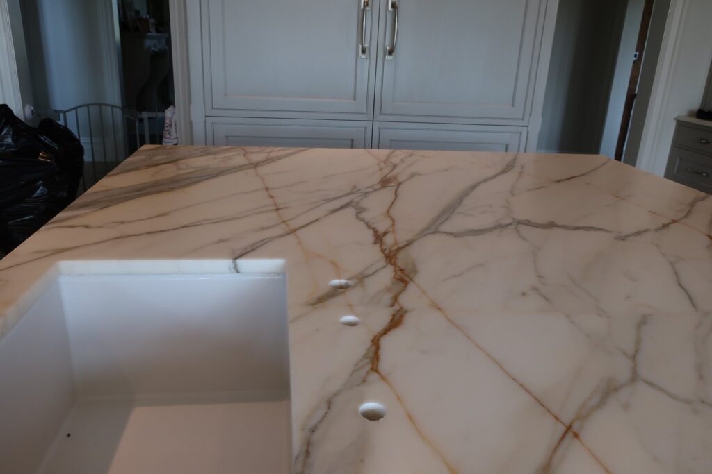 White stone countertop with gold and grey veining