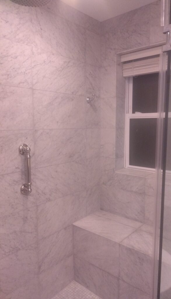 White stone shower from a Rose Restoration job in Washington, DC