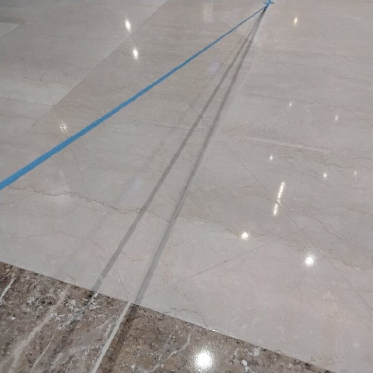 Polished stone floor with blue line, Rose Restoration project