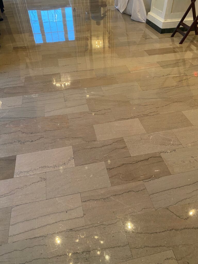 Polished stone floor with reflective surface, Rose Restoration project