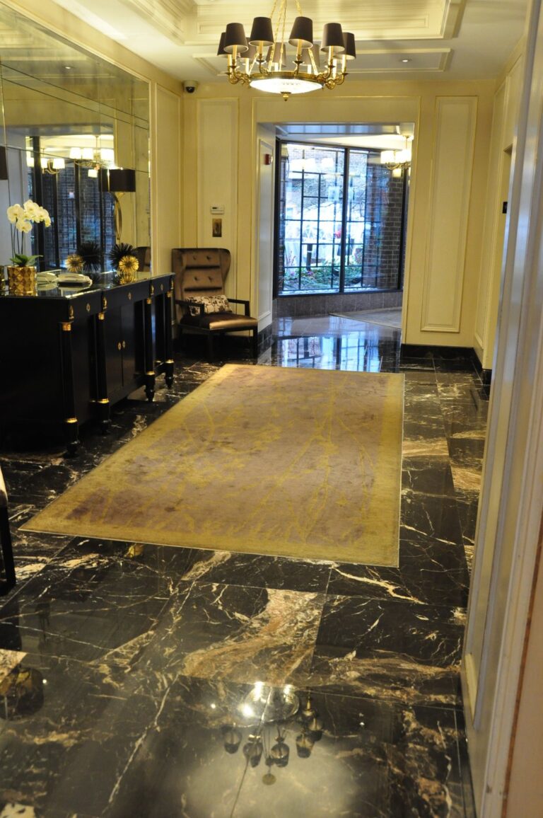 Polished marble floor with gold rug, Rose Restoration project