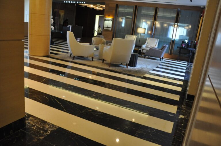 Striped stone floor with reflective finish, Rose Restoration project