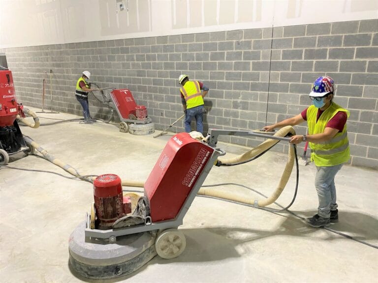 Concrete floor being sanded, Rose Restoration project