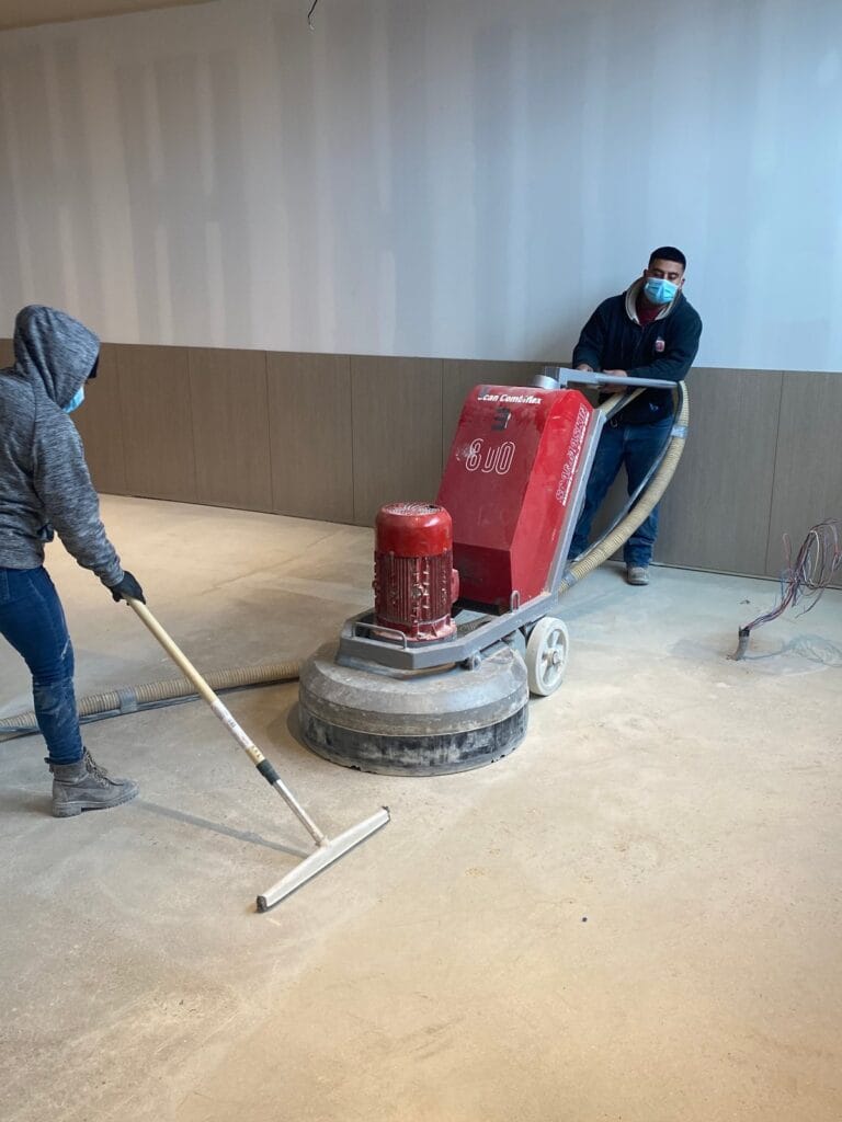 Concrete floor being sanded, Rose Restoration project