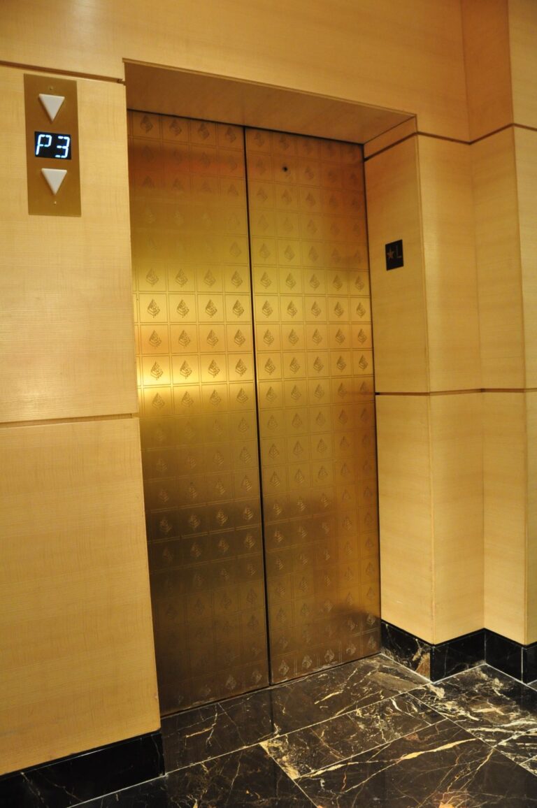 Gold patterned elevator doors, Rose Restoration project