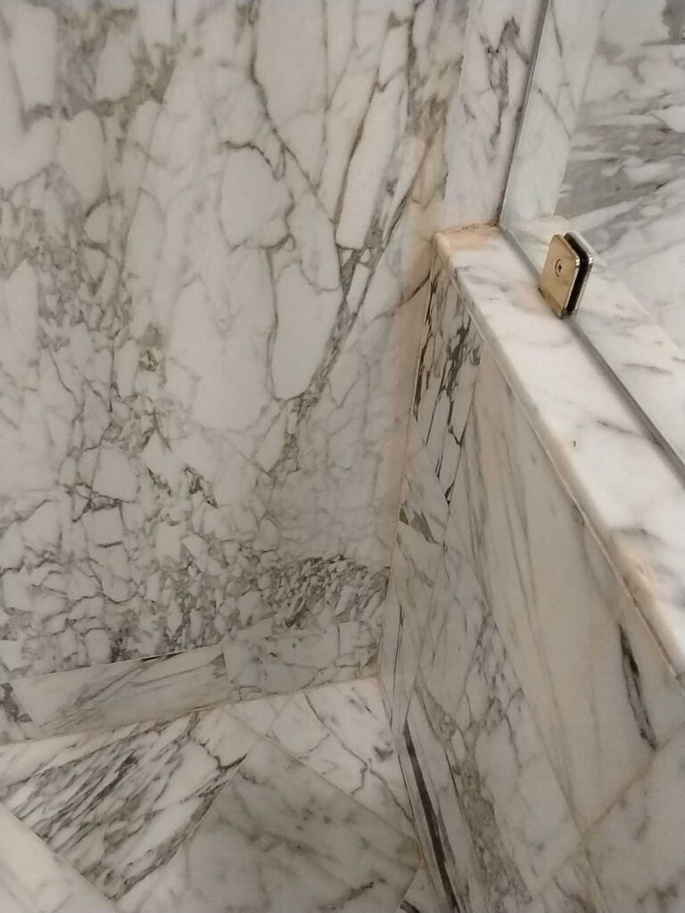 Marble shower wall with glass door, Rose Restoration project