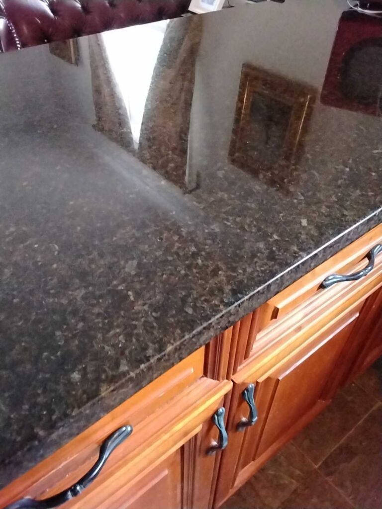 Granite countertop with wooden cabinets, Rose Restoration project