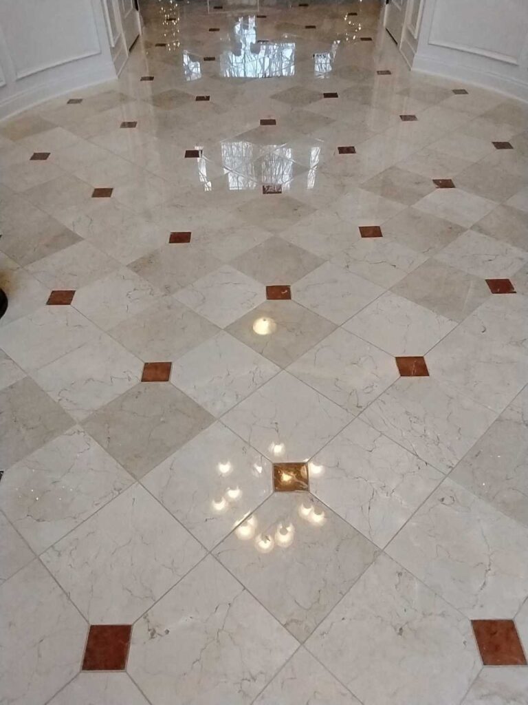 Polished marble floor with patterned accents, Rose Restoration project