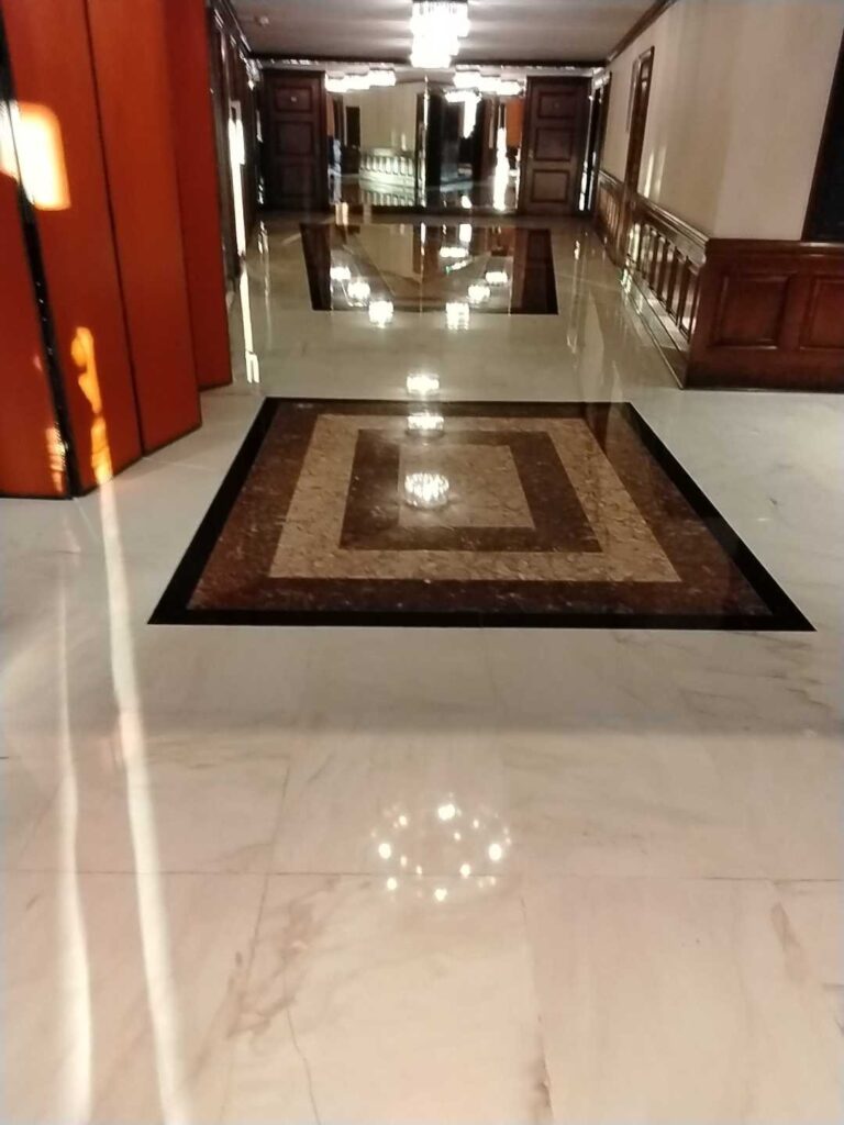 Polished marble floor with inset pattern, Rose Restoration project