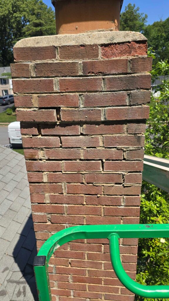 Before: exterior brick chimney in Annandale, VA, photographed by Rose Restoration before the work