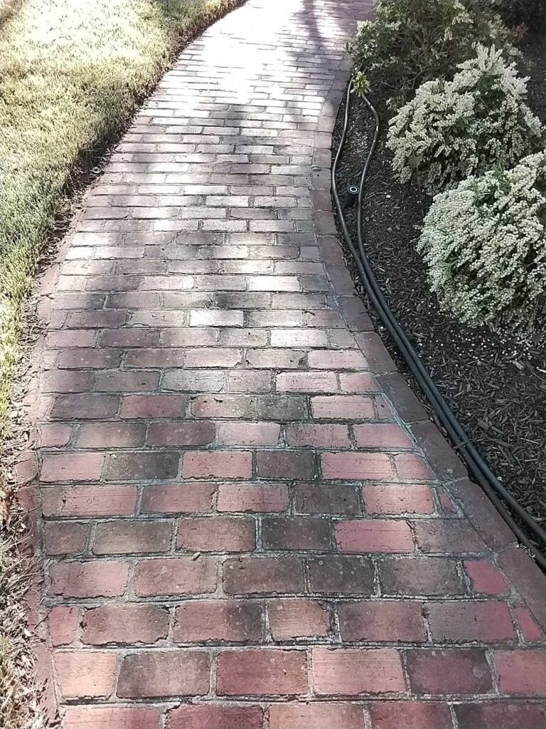 Before: brick walkway in Oakton, VA, photographed by Rose Restoration before the work