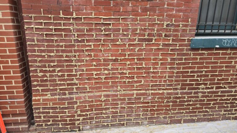 Brick wall with mortar joints, historic facade in Washington, DC, Rose Restoration project