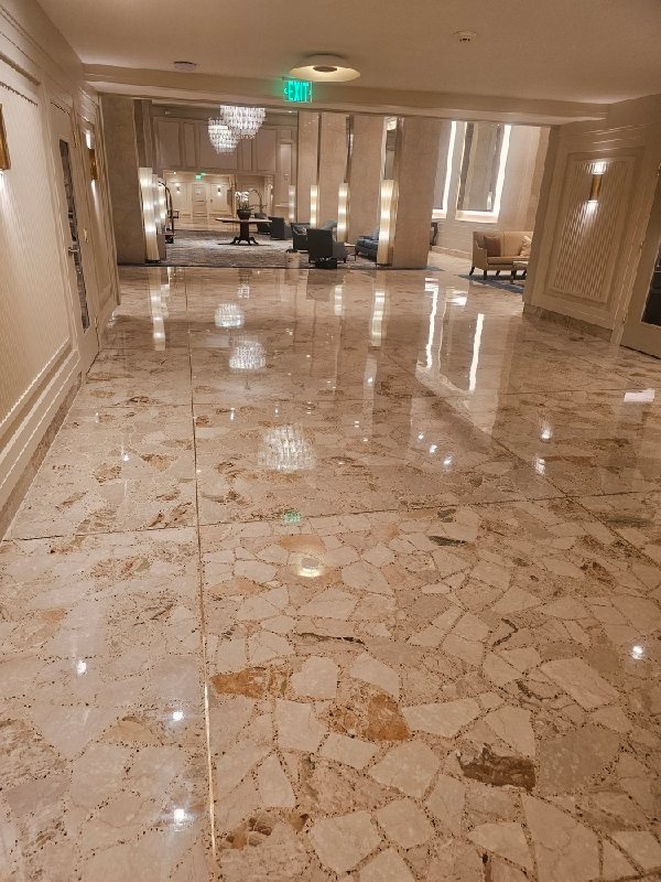 Polished stone floor with mosaic pattern, Rose Restoration project