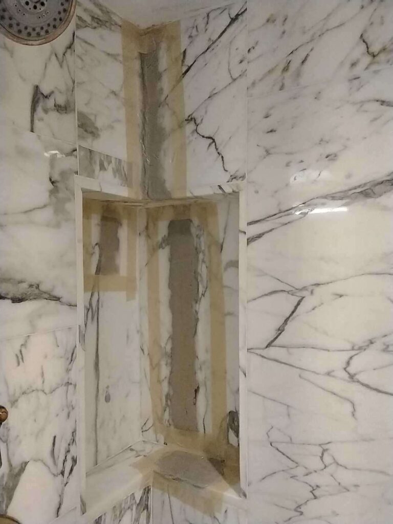 Marble shower stall with recessed shelf, Rose Restoration project