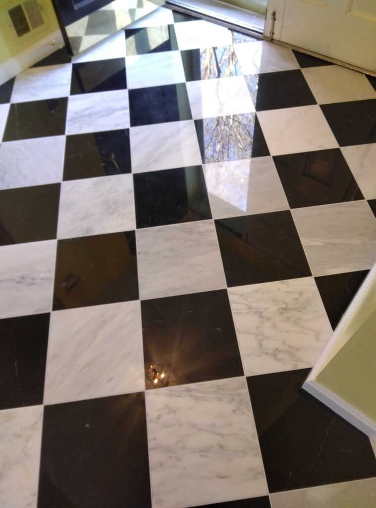 After: the same black and white checkerboard floor in McLean, VA after Rose Restoration's work