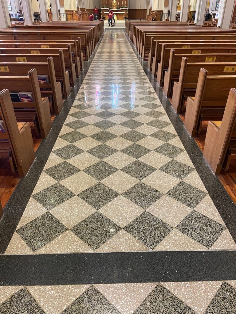 Checkered stone floor with black border in a church, Rose Restoration project