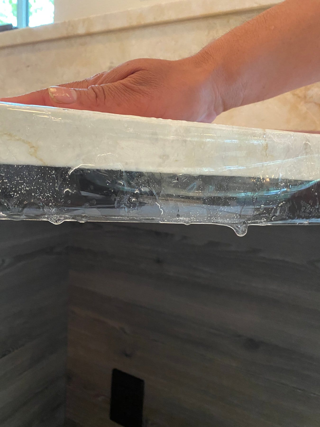 Close view of Marble Armor film wrapped over a countertop edge